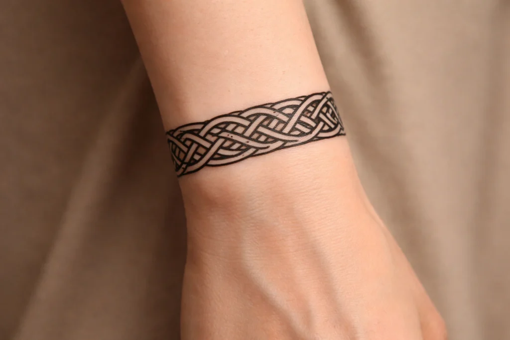 11. Celtic Knot Wrist Band Tattoos