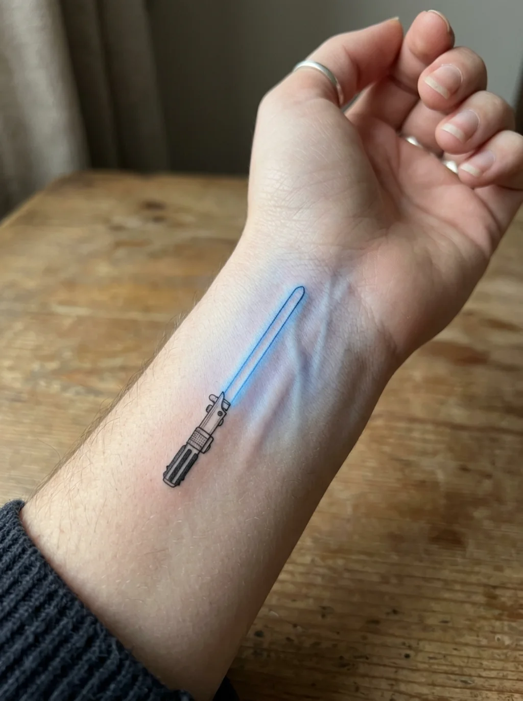 Fine Line Lightsaber Tattoos That Render the Galaxy in Impossible Delicacy